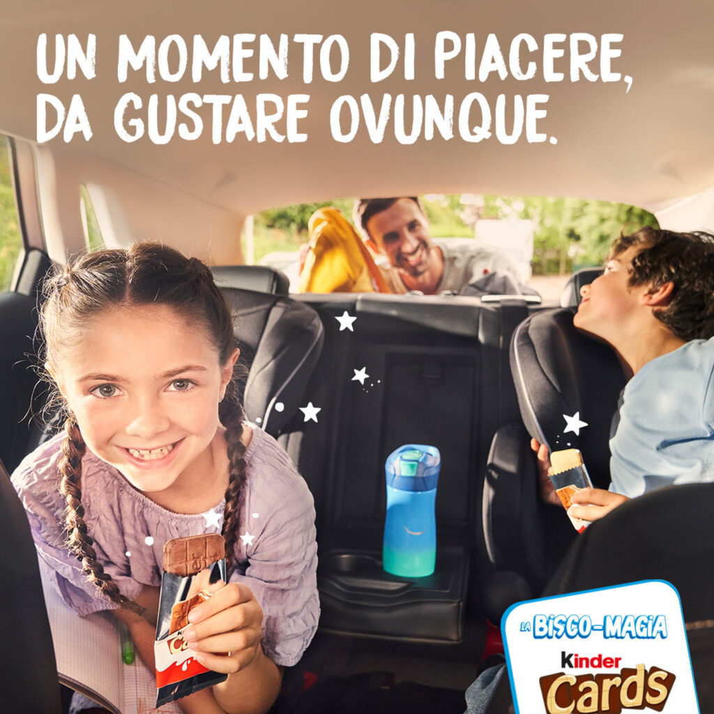 Kids sharing snacks in a vibrant car interior while enjoying Kinder Cards.